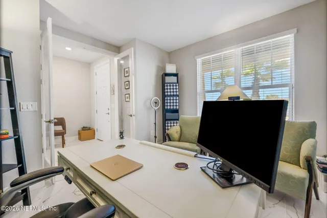 a kitchen with stainless steel appliances kitchen island granite countertop a refrigerator and a sink