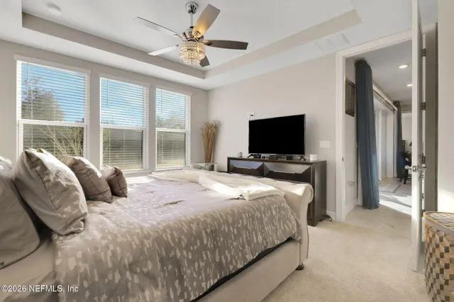 a living room with furniture a table and a potted plant