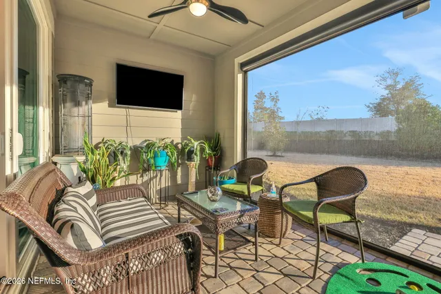 a view of a swimming pool with outdoor seating