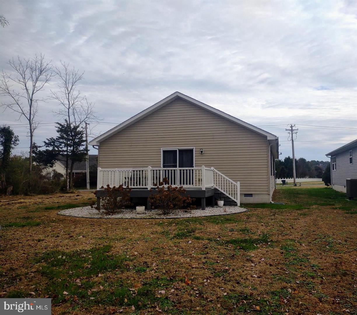 206 Decatur Street Berlin, MD 21811 - Photo 4 of 4 a backyard of a house with plants and barbeque oven