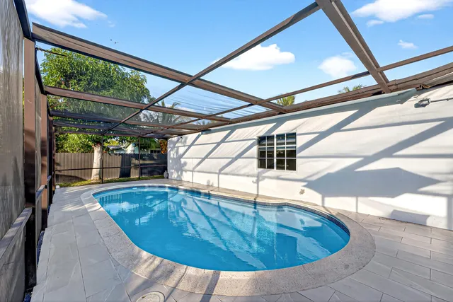 a view of a swimming pool with a patio