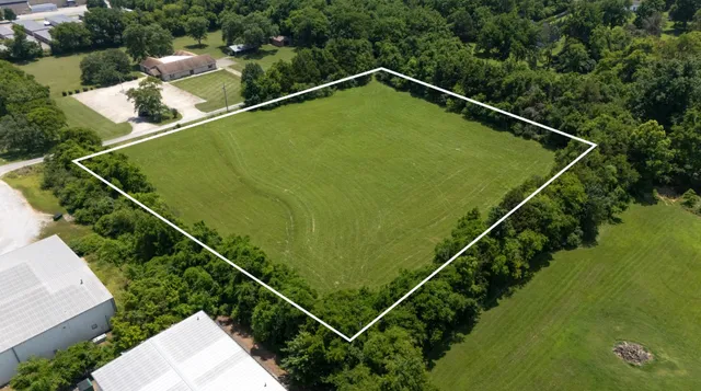 a view of a yard and front door