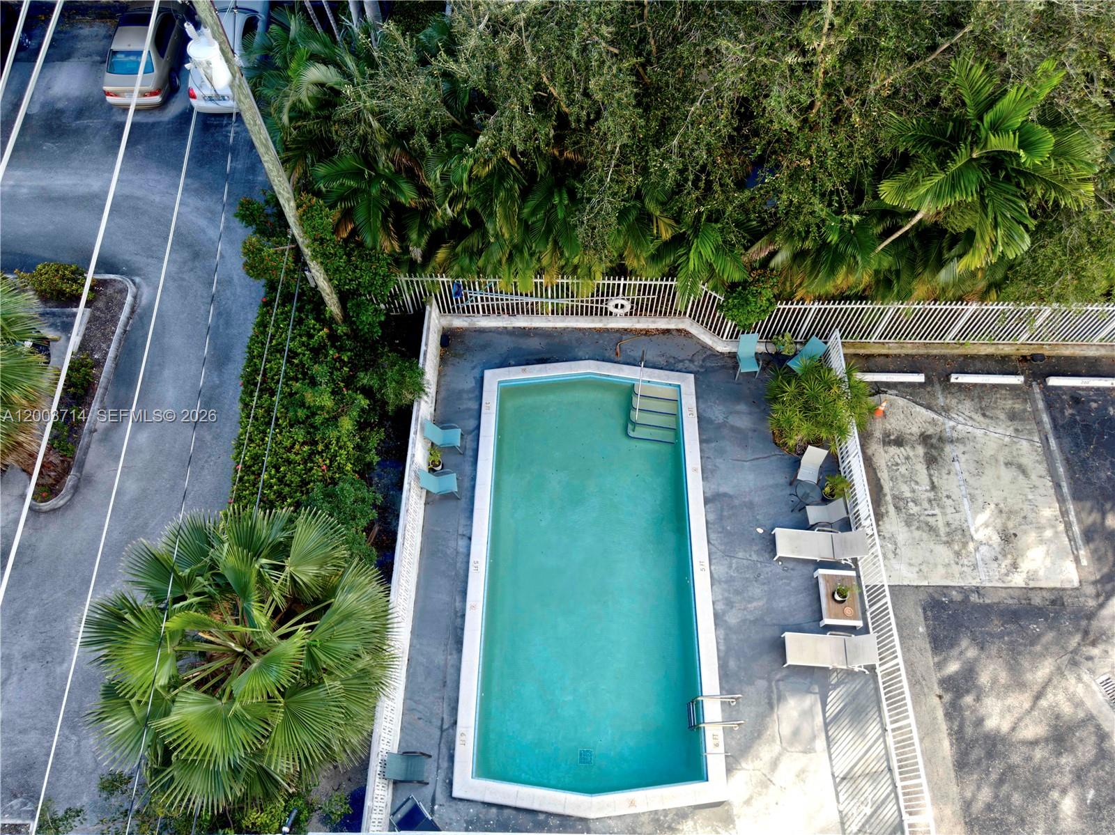 1340 Lincoln Road, Unit 709 Miami Beach, FL 33139 - Photo 12 of 13 a green field with trees in front of it