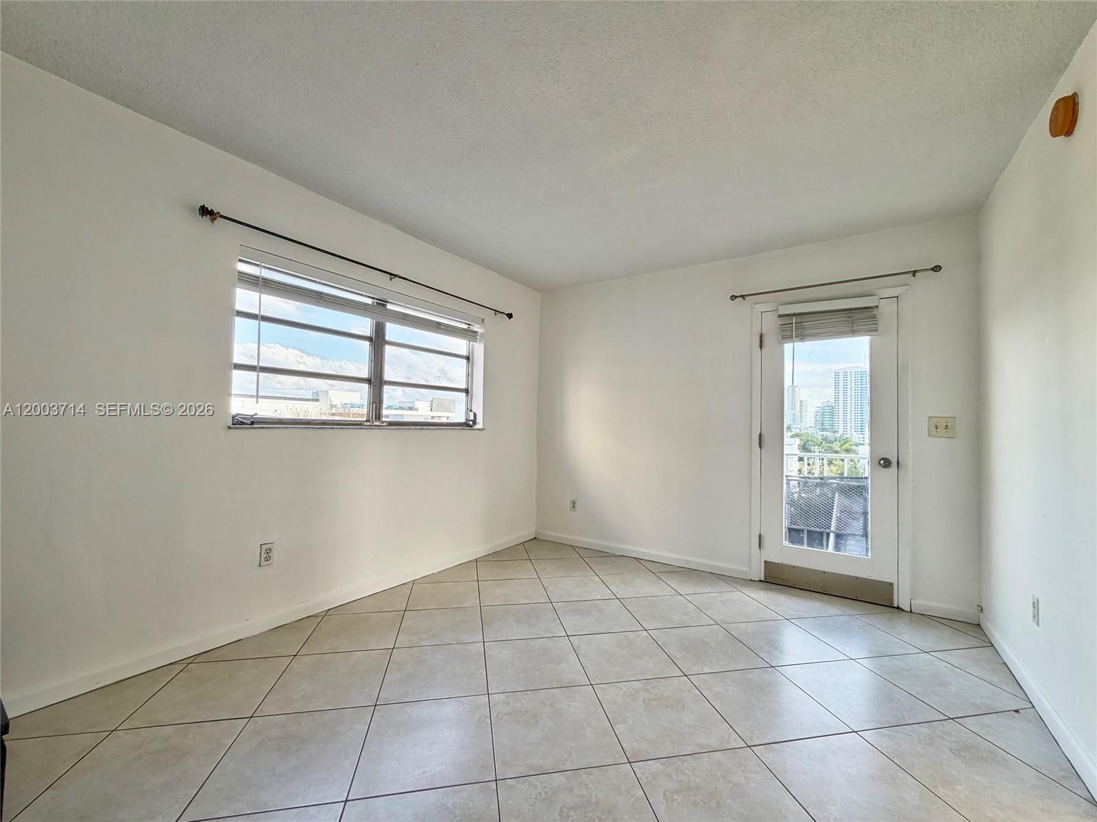1340 Lincoln Road, Unit 709 Miami Beach, FL 33139 - Photo 6 of 13 a view of an empty room with a window