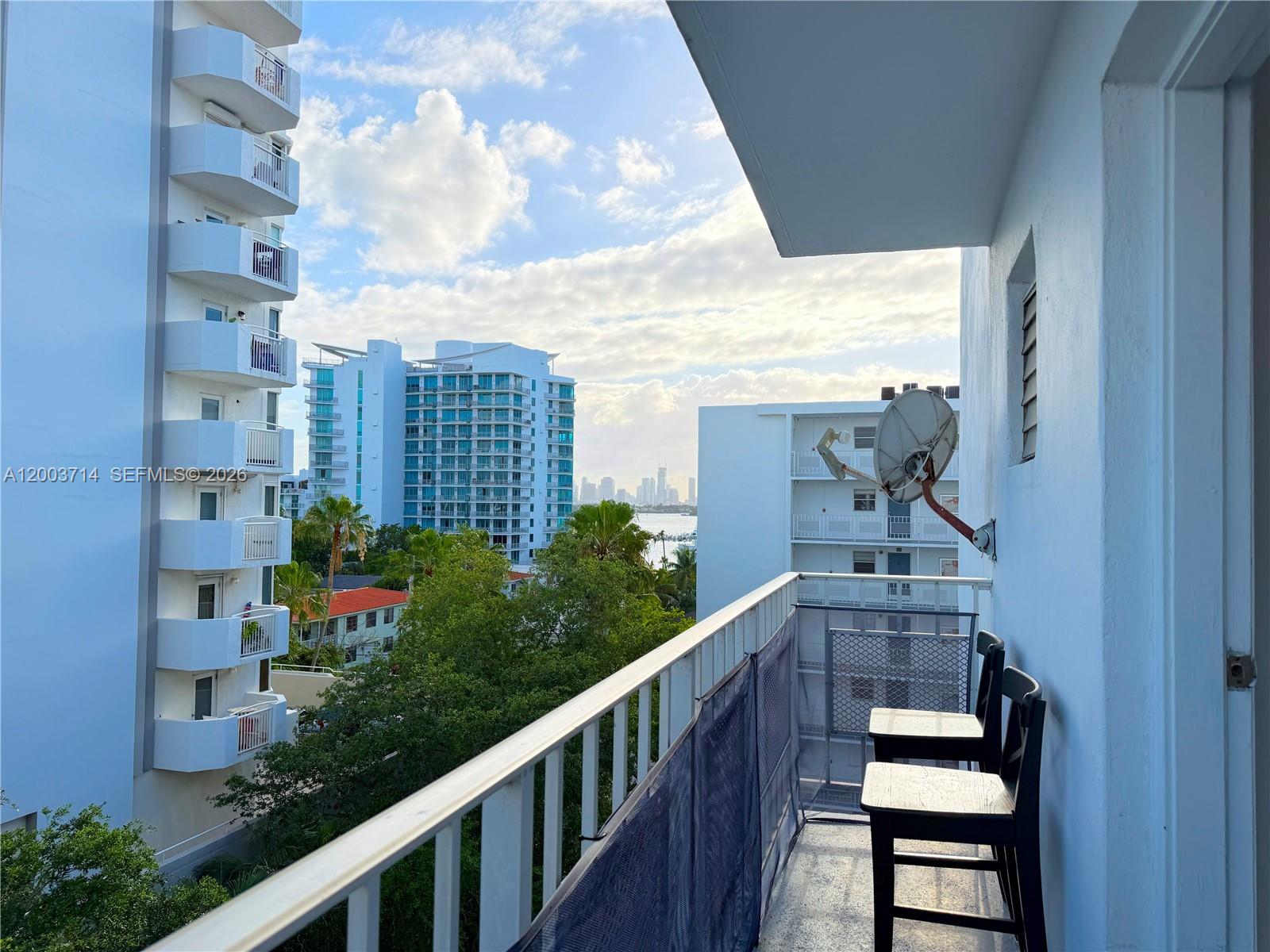 1340 Lincoln Road, Unit 709 Miami Beach, FL 33139 - Photo 10 of 13 a view of a balcony with outdoor seating and plants