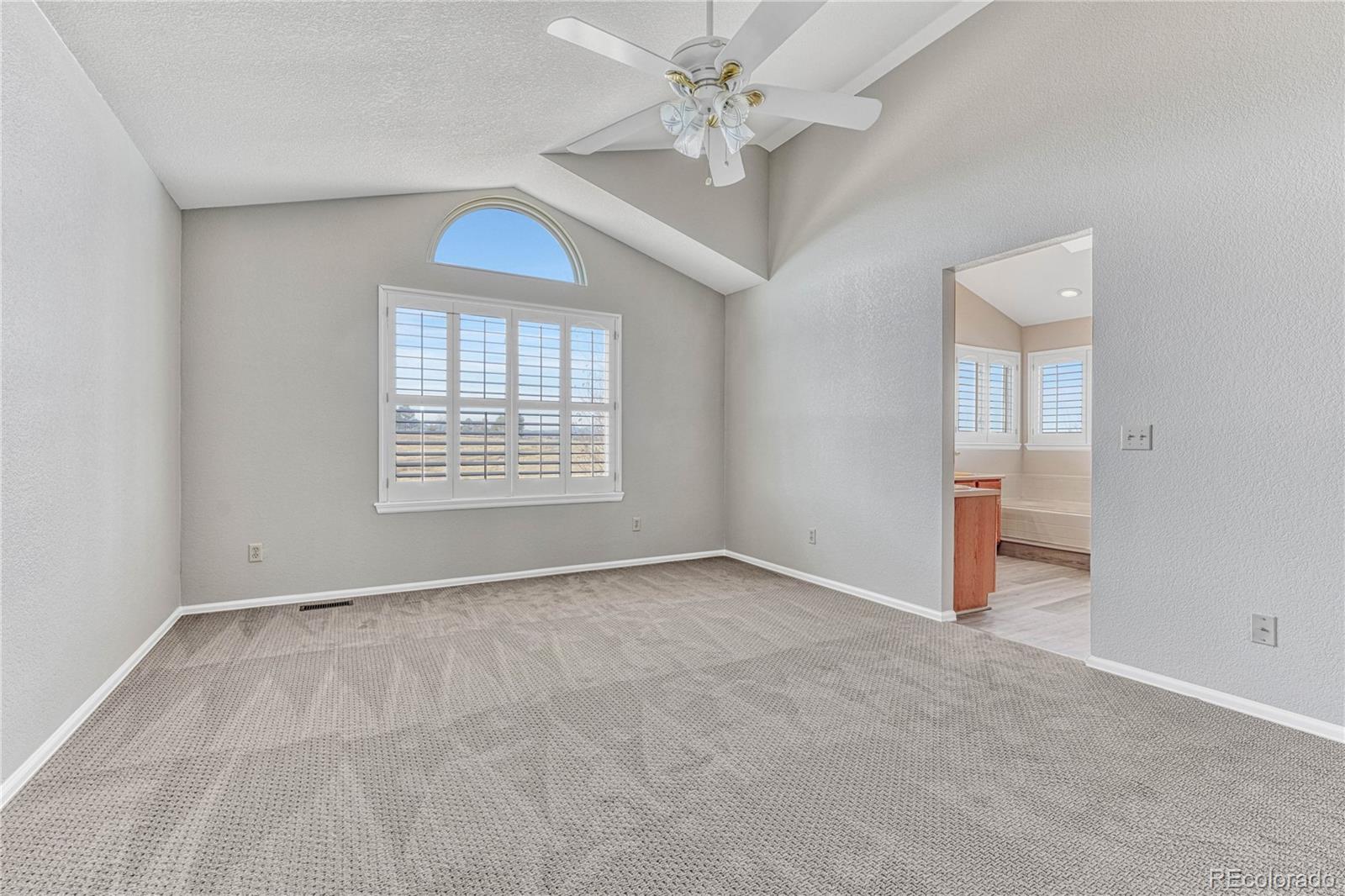9858 Venneford Ranch Road Highlands Ranch, CO 80126 - Photo 30 of 50 a view of an empty room with a window