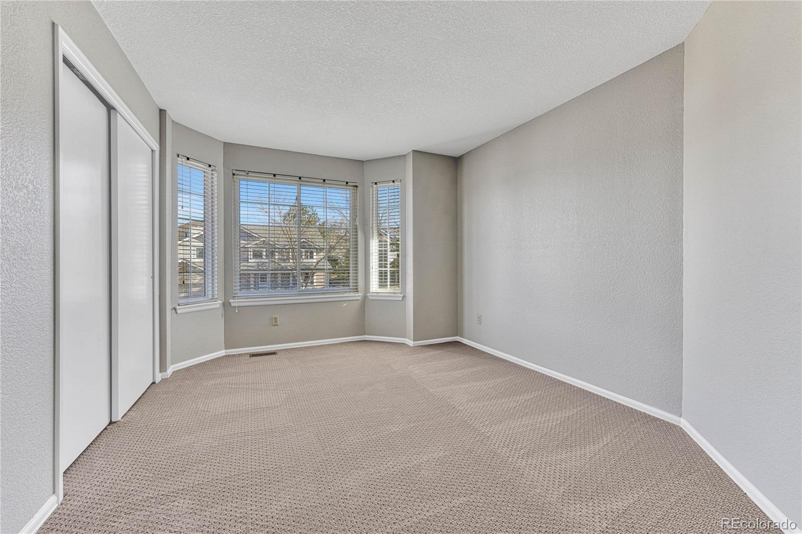 9858 Venneford Ranch Road Highlands Ranch, CO 80126 - Photo 35 of 50 a view of an empty room with a window