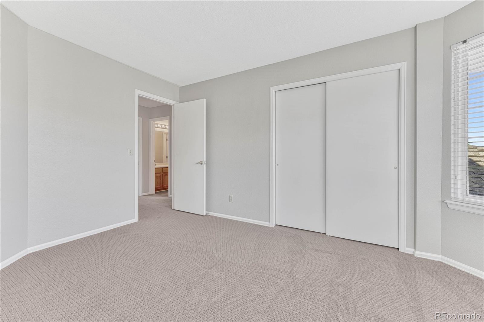 9858 Venneford Ranch Road Highlands Ranch, CO 80126 - Photo 36 of 50 a view of an empty room and closet area