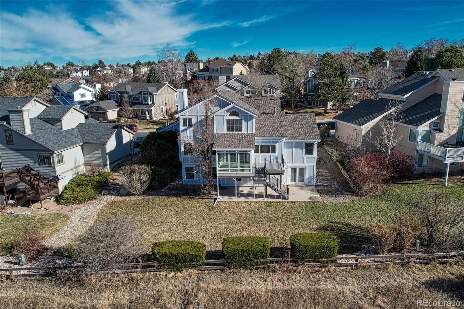 9858 Venneford Ranch Road Highlands Ranch, CO 80126 - Photo 40 of 50 an aerial view of a house with a yard