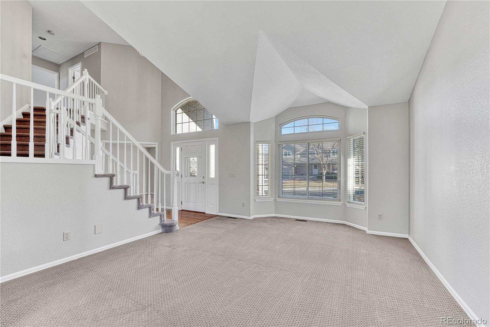 9858 Venneford Ranch Road Highlands Ranch, CO 80126 - Photo 6 of 50 a view of an empty room with a window