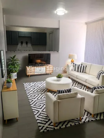 a kitchen with a refrigerator and a stove