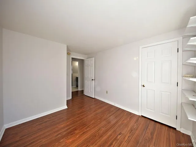 a bathroom with a toilet a sink and a mirror
