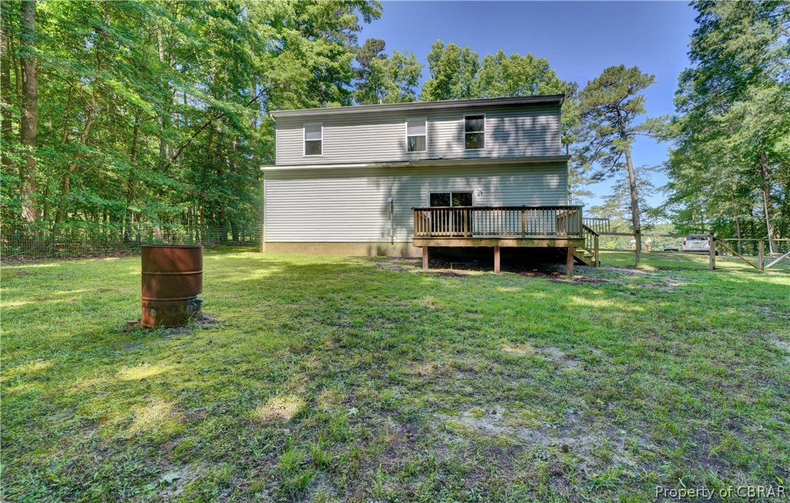 8269 Ark Road Gloucester, VA 23061 - Photo 24 of 33 Back of property with a deck and a yard
