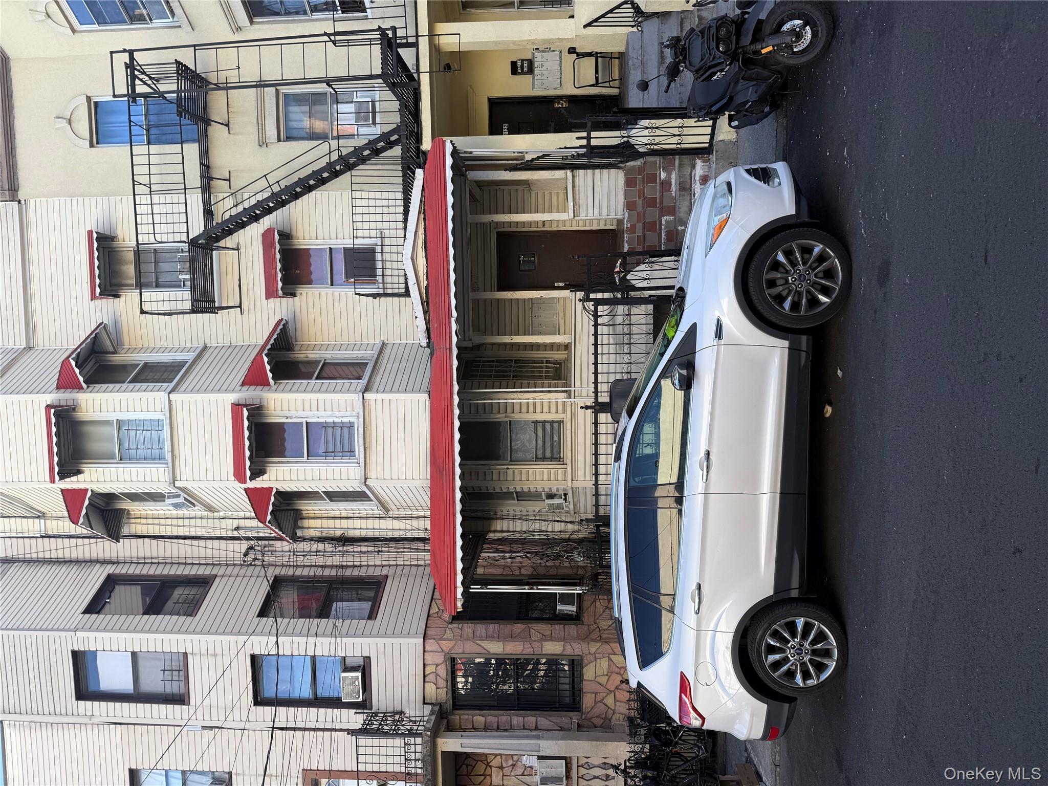 a view of a car parked in front of a building