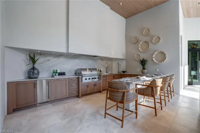a kitchen with a table and chairs in it