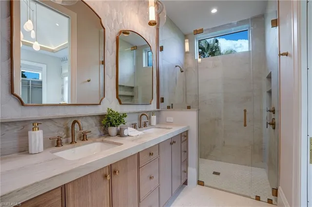 a bathroom with a shower sink and mirror