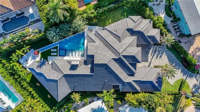 a view of house with a yard and furniture