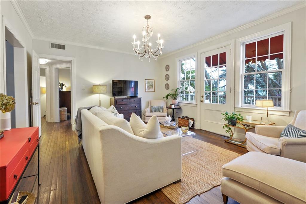 2230 Peachtree Road Northwest, Unit A5 Atlanta, GA 30309 - Photo 1 of 26 a living room with furniture and a chandelier