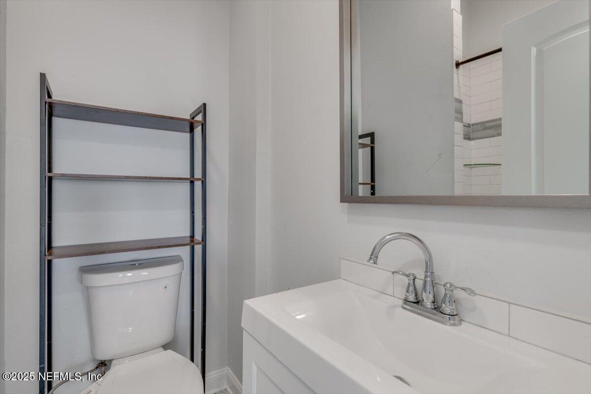 933 Talbot Avenue Jacksonville, FL 32205 - Photo 29 of 41 a bathroom with a sink and mirror