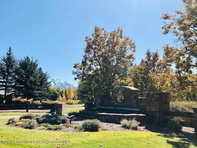 a view of a house with swimming pool and a yard