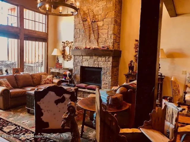 a living room with furniture windows and a fireplace