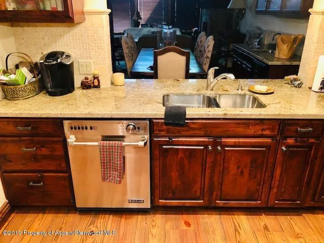 a close view of sink and cabinets
