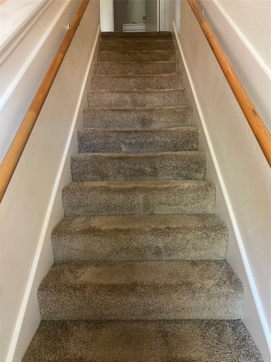 16302 Embry Hills Drive Houston, TX 77073 - Photo 14 of 16 a view of staircase with white walls