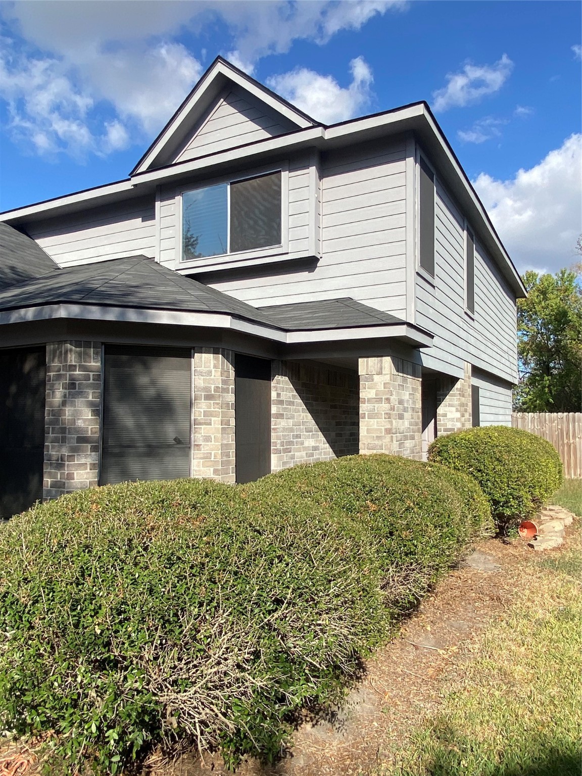 16302 Embry Hills Drive Houston, TX 77073 - Photo 5 of 16 a front view of a house with a yard