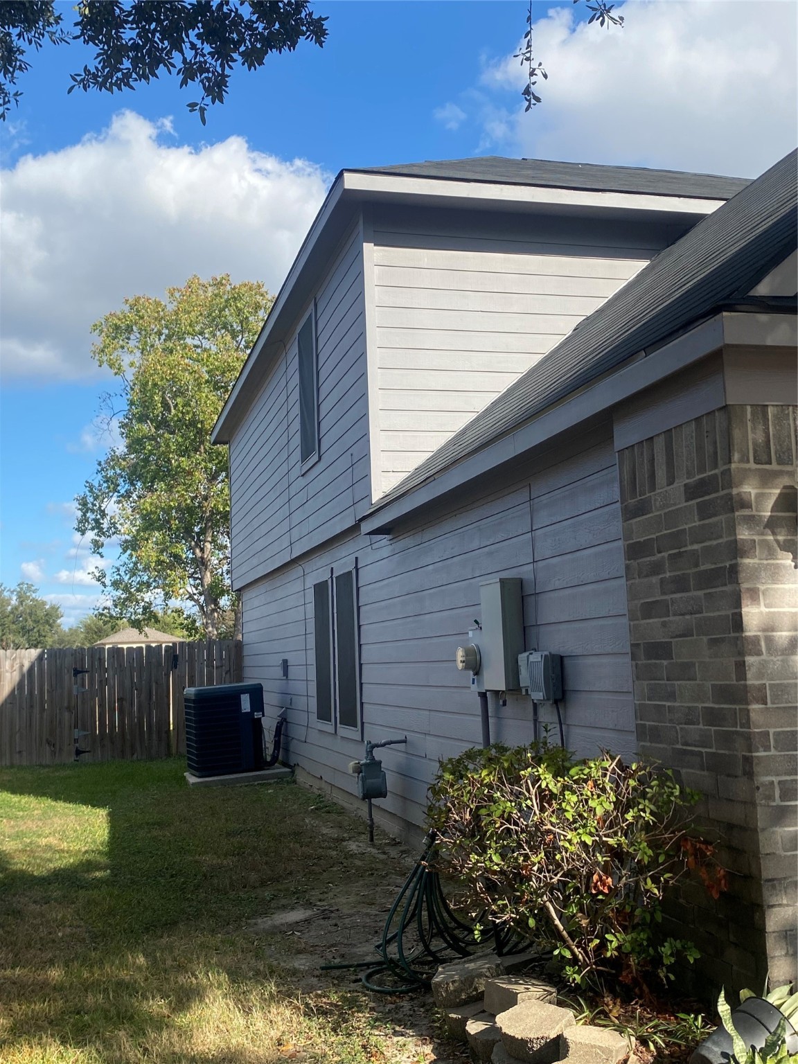 16302 Embry Hills Drive Houston, TX 77073 - Photo 7 of 16 a front view of a house with garden
