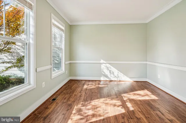 a bathroom with a granite countertop sink a mirror and a bathtub