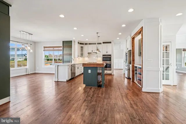 a view of an empty room with window and closet area