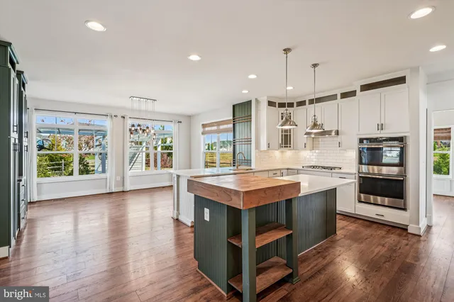 a white bath tub sitting next to a white toilet