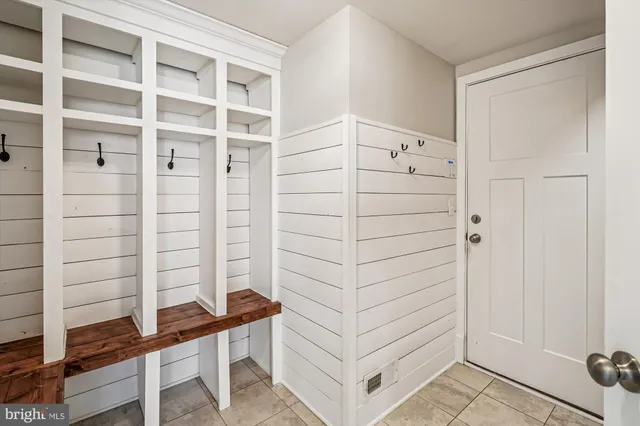 a view of an empty room with furniture