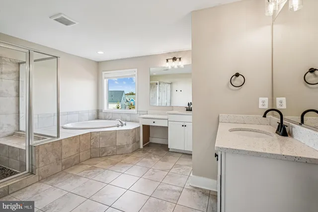 a view of a fountain in front of a house with a big yard