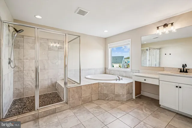 a view of a lake with houses in the background