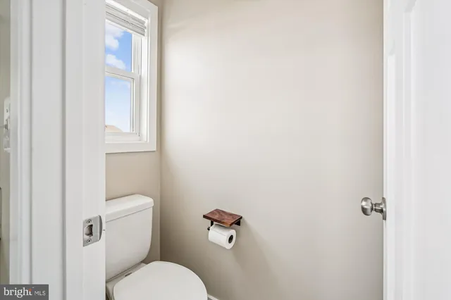 an aerial view of a house with swimming pool lake view and mountain view