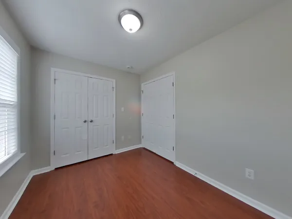 an empty room with a empty space and a window