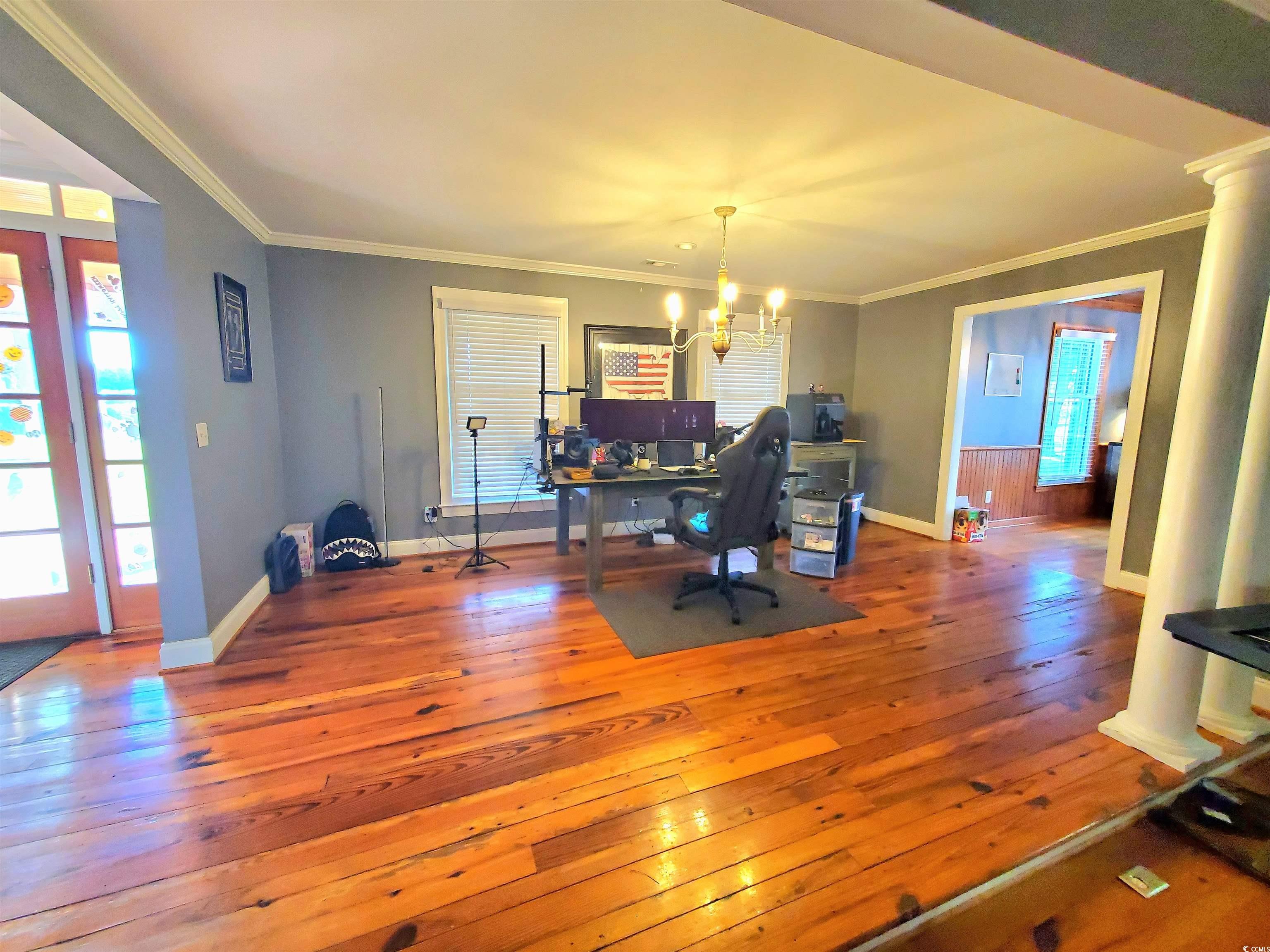 1484 Fitch Road Lake City, SC 29560 - Photo 14 of 40 Home office with hardwood / wood-style floors, ornamental molding, and a chandelier