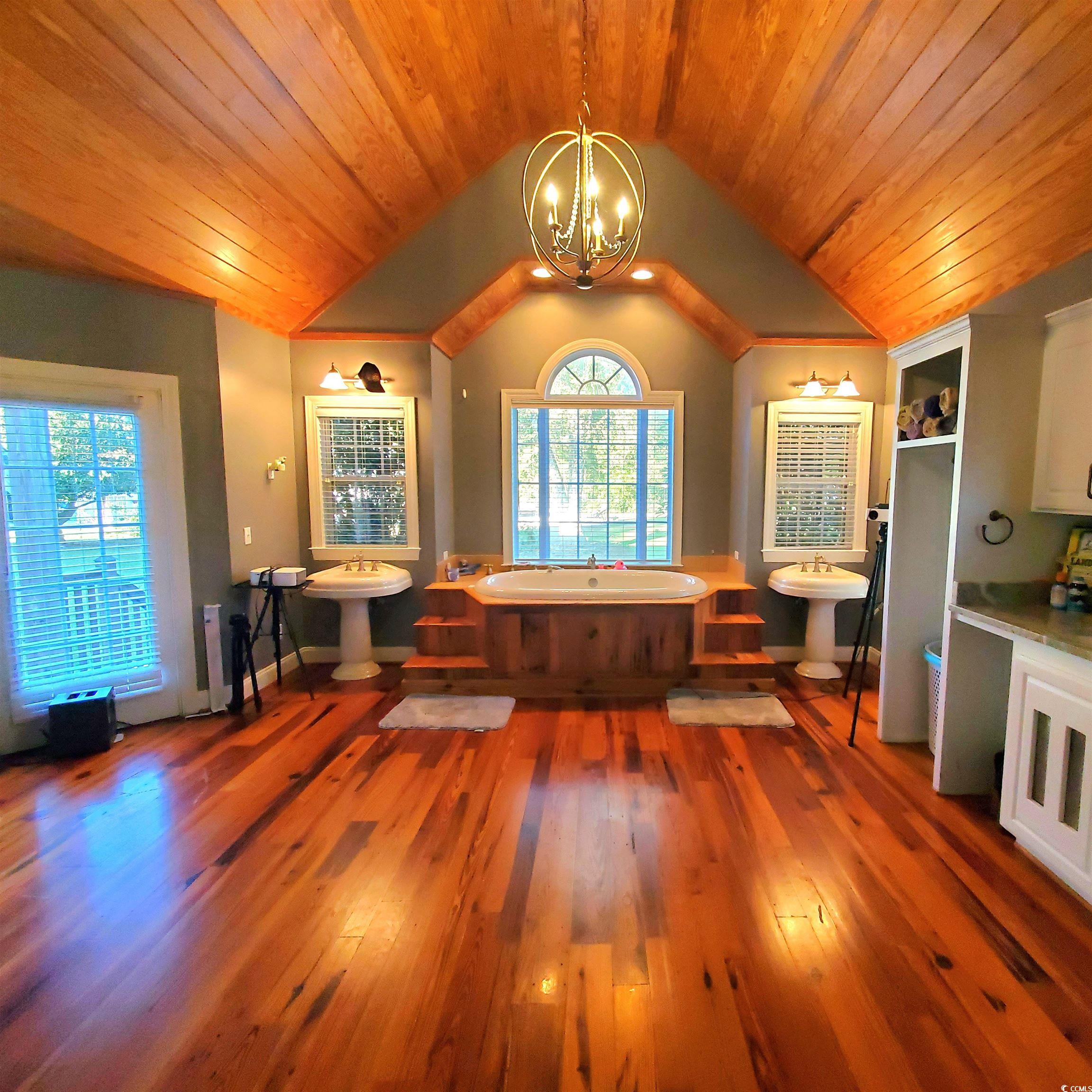 1484 Fitch Road Lake City, SC 29560 - Photo 21 of 40 Grande Bathroom featuring wood ceiling, dark wood-type flooring, vaulted ceiling, and a chandelier