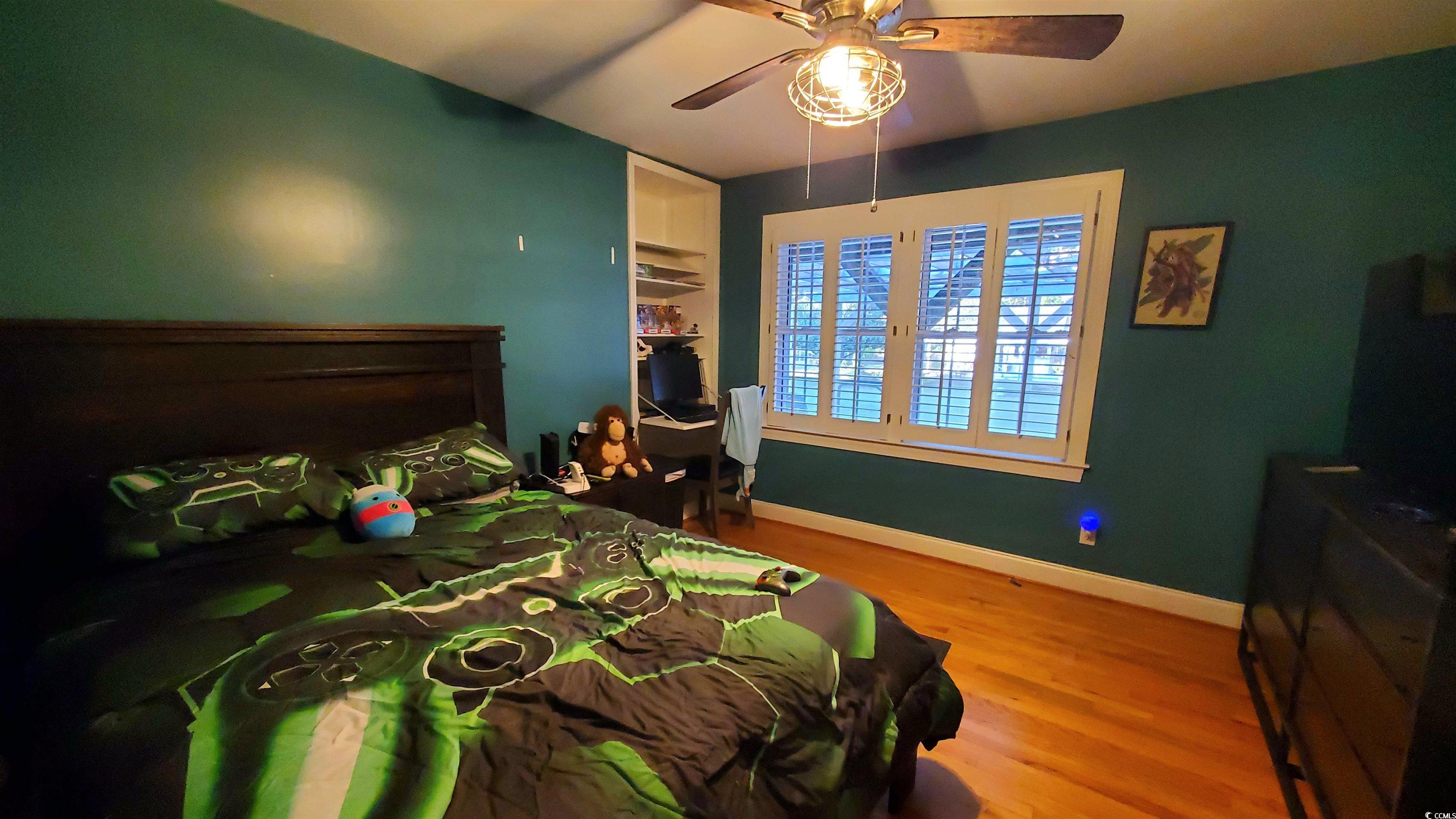 1484 Fitch Road Lake City, SC 29560 - Photo 23 of 40 Bedroom with wood finished floors and ceiling fan