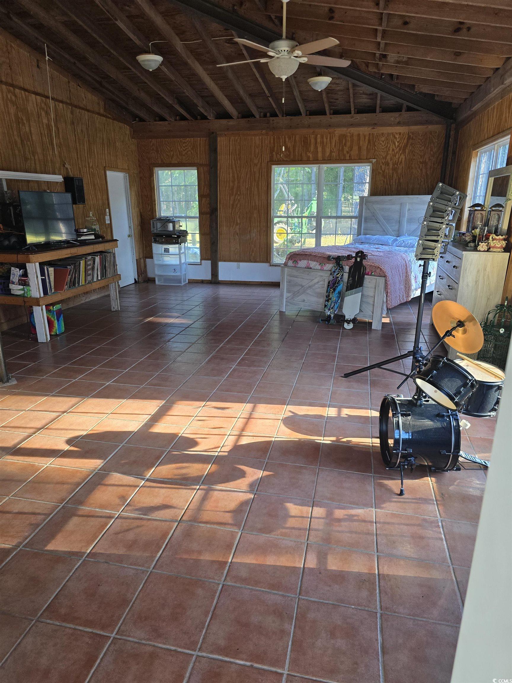 1484 Fitch Road Lake City, SC 29560 - Photo 29 of 40 Garage featuring wood walls and a ceiling fan