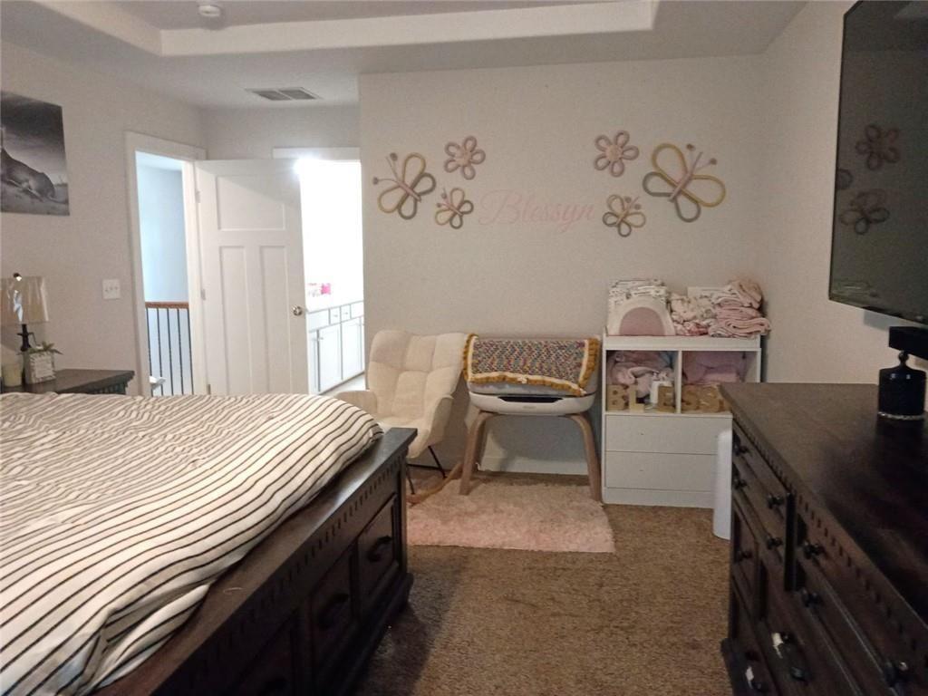 807 Ridgeview Court Hampton, GA 30228 - Photo 39 of 69 a bedroom with a bed and a desk in it