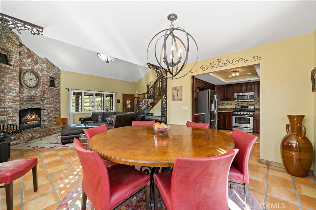 40995 Vía Fernando Temecula, CA 92592 - Photo 21 of 52 Dining room looking into living room virtually staged