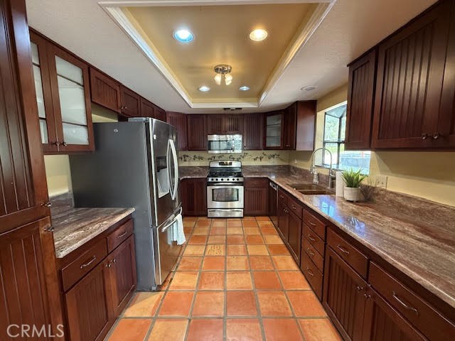 40995 Vía Fernando Temecula, CA 92592 - Photo 22 of 52 a large kitchen with stainless steel appliances granite countertop wooden cabinets a sink dishwasher a stove and a refrigerator