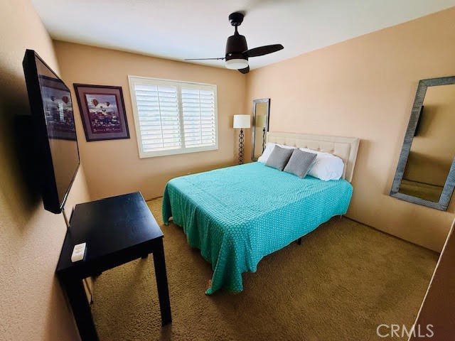 40995 Vía Fernando Temecula, CA 92592 - Photo 24 of 52 a bedroom with a bed a dresser and a window
