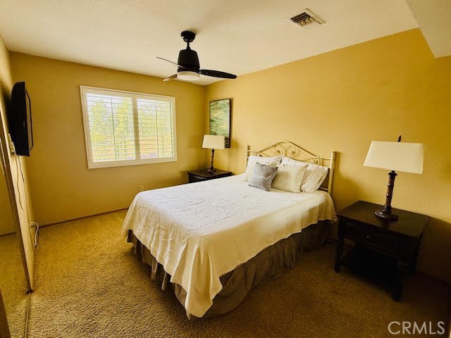 40995 Vía Fernando Temecula, CA 92592 - Photo 25 of 52 a bedroom with a bed and a window