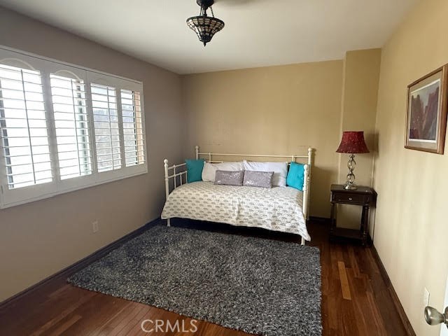 40995 Vía Fernando Temecula, CA 92592 - Photo 30 of 52 a bedroom with a bed and wooden floor