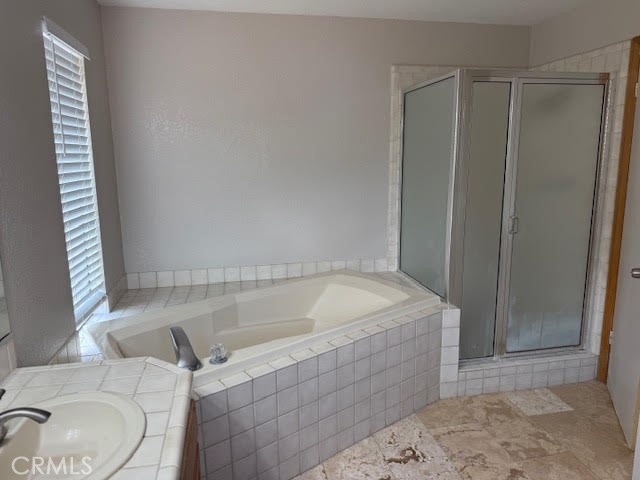 40995 Vía Fernando Temecula, CA 92592 - Photo 33 of 52 a bathroom with a tub and a shower