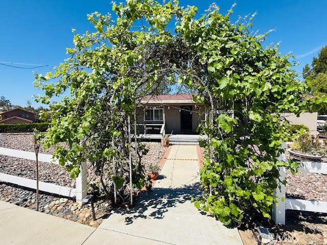 40995 Vía Fernando Temecula, CA 92592 - Photo 37 of 52 a front view of a house with a garden