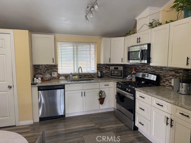 40995 Vía Fernando Temecula, CA 92592 - Photo 44 of 52 a kitchen with stainless steel appliances granite countertop a stove a sink and a refrigerator
